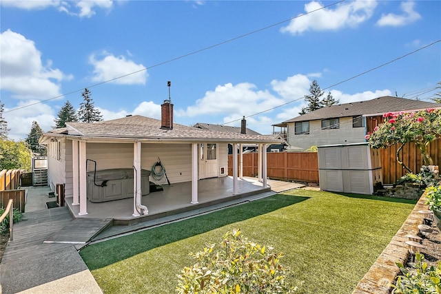 7351 32nd Ave SW, Seattle, WA 98126 - rear view of property with a wooden deck, a chimney, and an outdoor structure