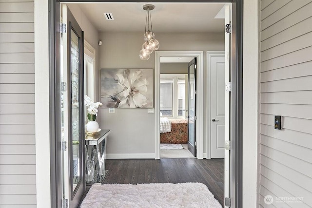 3319 Burnett Ave N, Renton, WA 98056 - foyer with baseboards and dark wood-type flooring