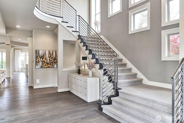 3319 Burnett Ave N, Renton, WA 98056 - stairway featuring wood finished floors, recessed lighting, and a high ceiling