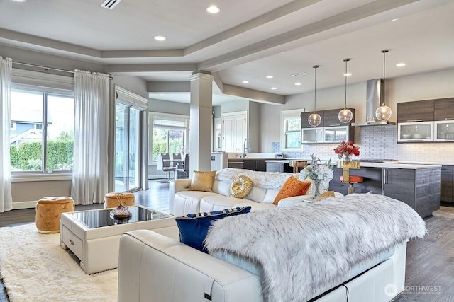 3319 Burnett Ave N, Renton, WA 98056 - living room featuring wood finished floors, recessed lighting, and ornate columns