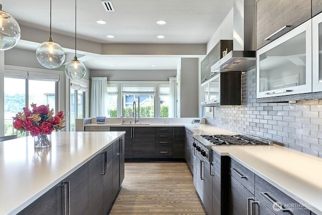 3319 Burnett Ave N, Renton, WA 98056 - kitchen featuring exhaust hood, stainless steel gas cooktop, plenty of natural light, light countertops, and recessed lighting