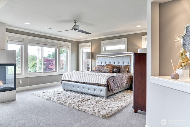 3319 Burnett Ave N, Renton, WA 98056 - carpeted bedroom with crown molding, recessed lighting, ceiling fan, and a multi sided fireplace
