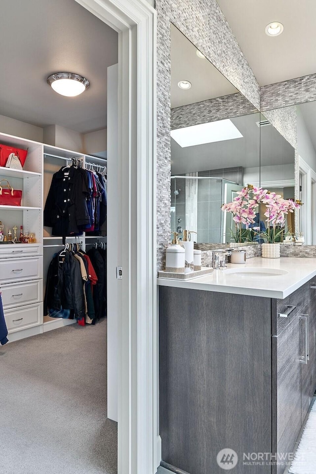 3319 Burnett Ave N, Renton, WA 98056 - bathroom with vanity, a spacious closet, and a shower with door