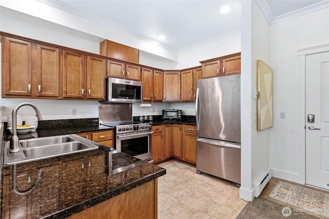 1015 Railroad Ave Unit 405, Bellingham, WA 98225 - kitchen with appliances with stainless steel finishes, a sink, a baseboard heating unit, ornamental molding, and brown cabinetry
