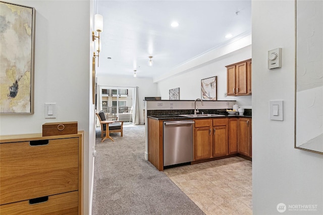 1015 Railroad Ave Unit 405, Bellingham, WA 98225 - kitchen featuring stainless steel dishwasher, a sink, a peninsula, and brown cabinetry