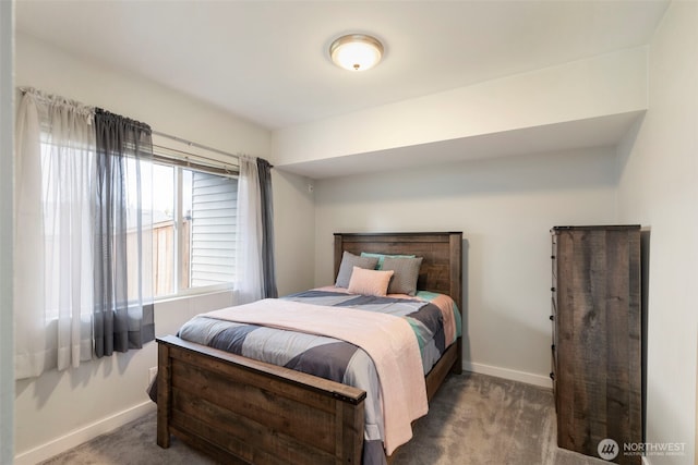 carpeted bedroom with baseboards