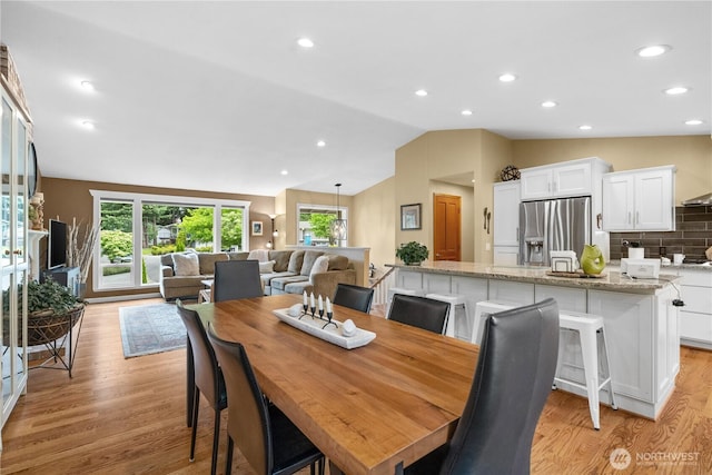 10811 164th Pl NE, Redmond, WA 98052 - dining space featuring vaulted ceiling, light wood-type flooring, and recessed lighting