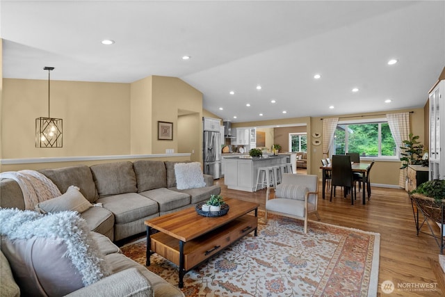 10811 164th Pl NE, Redmond, WA 98052 - living room featuring vaulted ceiling, recessed lighting, and light wood-style flooring