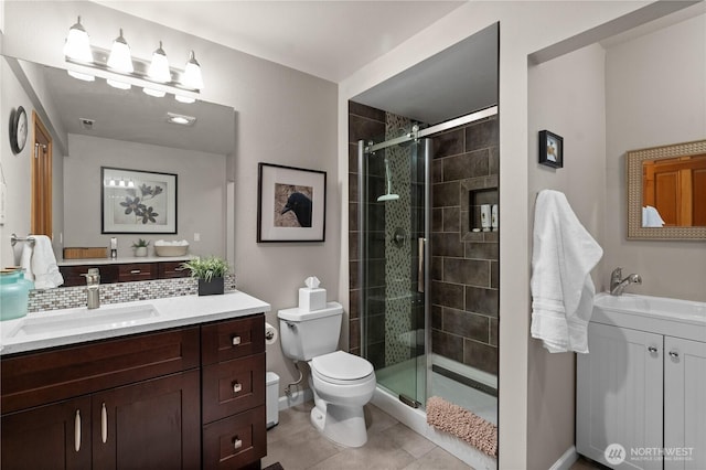 10811 164th Pl NE, Redmond, WA 98052 - full bath with toilet, vanity, a shower stall, tile patterned flooring, and baseboards