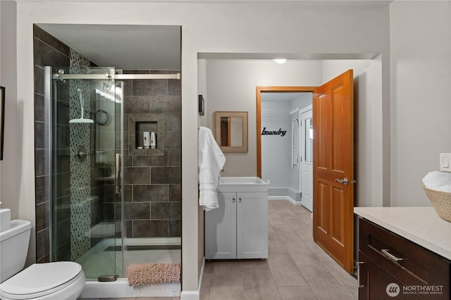10811 164th Pl NE, Redmond, WA 98052 - bathroom featuring vanity, toilet, and a stall shower