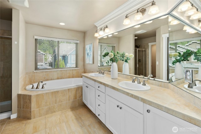 full bathroom featuring a shower stall, plenty of natural light, a bath, and tile patterned flooring