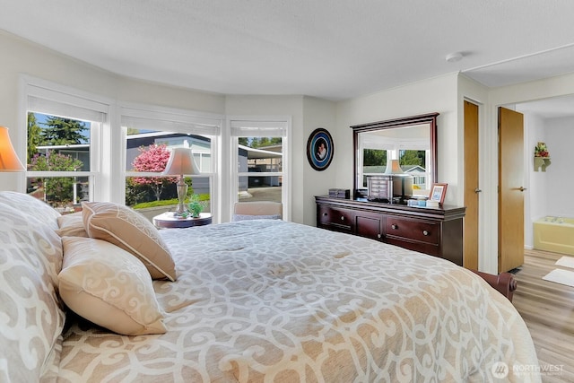 bedroom with wood finished floors