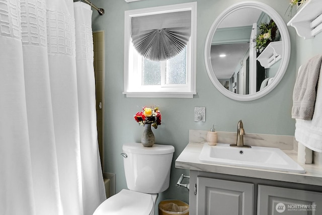 bathroom featuring vanity and toilet