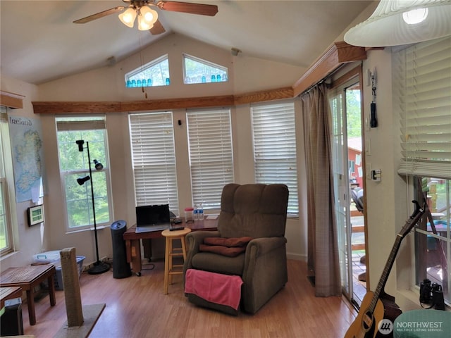 sitting room featuring a ceiling fan, vaulted ceiling, wood finished floors, and an office area