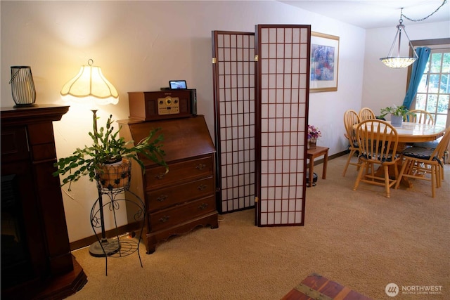 sitting room with light colored carpet and baseboards