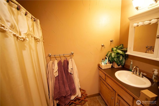 bathroom with vanity and tile patterned flooring