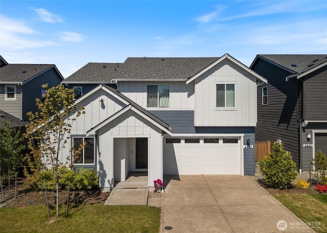 view of front of home featuring board and batten siding, concrete driveway, a garage, and a shingled roof