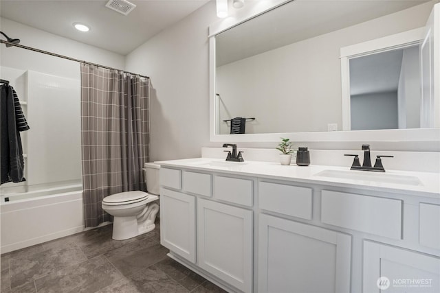bathroom with toilet, double vanity, shower / bath combo, and recessed lighting
