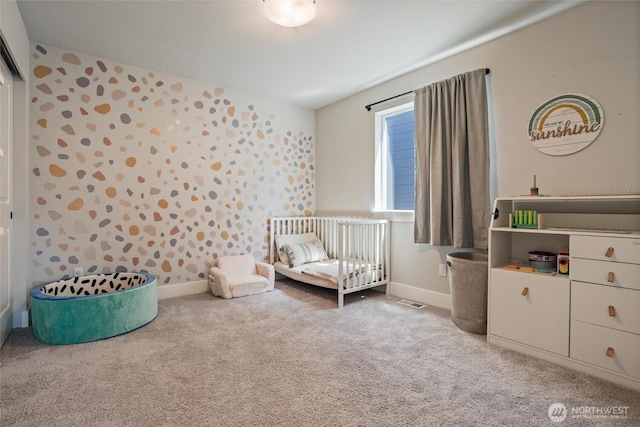 bedroom featuring carpet and baseboards
