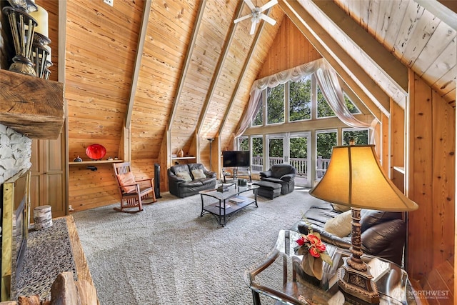 1418 E Blackburn Rd, Mount Vernon, WA 98274 - living room with carpet floors, wood ceiling, wooden walls, beamed ceiling, and a stone fireplace