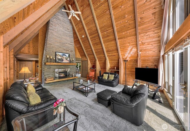 1418 E Blackburn Rd, Mount Vernon, WA 98274 - living room with carpet, beam ceiling, wooden ceiling, high vaulted ceiling, and a stone fireplace