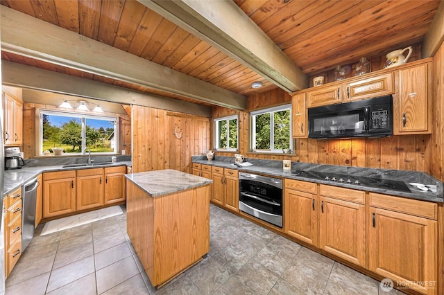 1418 E Blackburn Rd, Mount Vernon, WA 98274 - kitchen with black appliances, a sink, wooden ceiling, wooden walls, and dark stone countertops