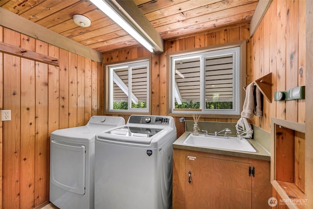 1418 E Blackburn Rd, Mount Vernon, WA 98274 - laundry area featuring wood ceiling, washer and clothes dryer, and wooden walls