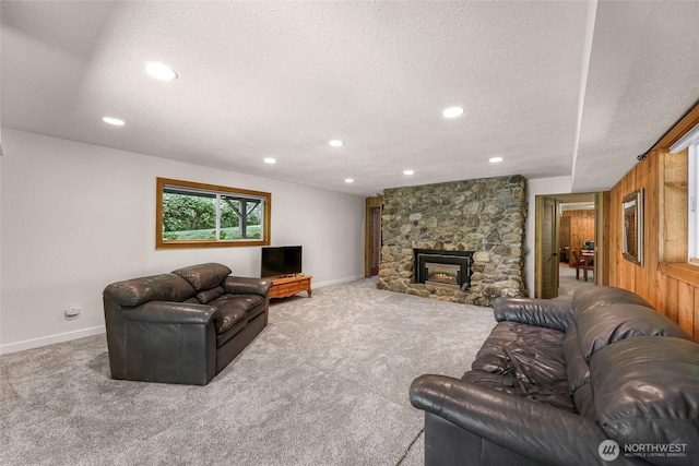 1418 E Blackburn Rd, Mount Vernon, WA 98274 - carpeted living area with baseboards, recessed lighting, a textured ceiling, and a fireplace