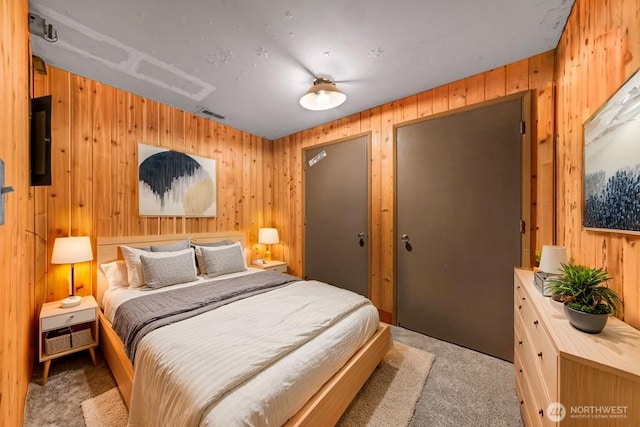 1418 E Blackburn Rd, Mount Vernon, WA 98274 - bedroom featuring carpet flooring, wooden walls, and multiple closets
