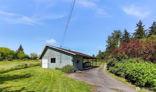 1418 E Blackburn Rd, Mount Vernon, WA 98274 - view of side of home featuring a yard and a carport