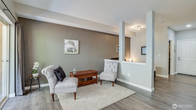 564 225th Ln NE Unit A-105, Sammamish, WA 98074 - living area with wood finished floors, baseboards, and recessed lighting
