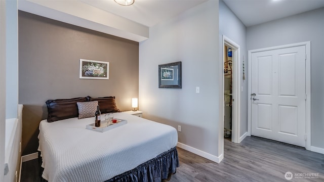 564 225th Ln NE Unit A-105, Sammamish, WA 98074 - bedroom with baseboards and wood finished floors