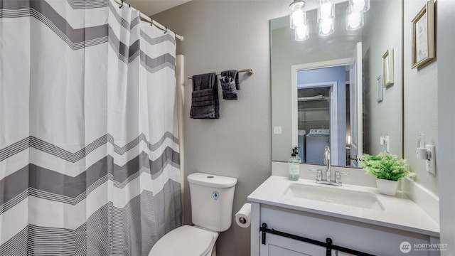 564 225th Ln NE Unit A-105, Sammamish, WA 98074 - full bath with toilet, vanity, and washer and clothes dryer