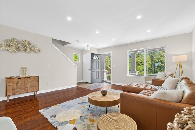 living room featuring wood finished floors, recessed lighting, and baseboards