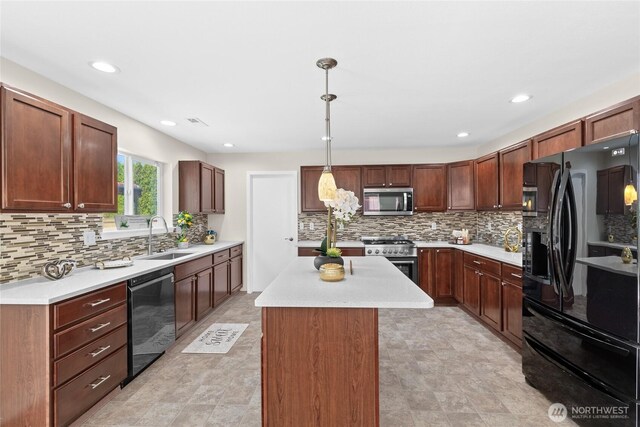 kitchen featuring black appliances, a sink, backsplash, a center island, and light countertops