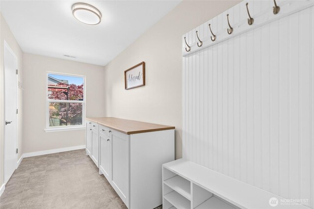 mudroom featuring baseboards