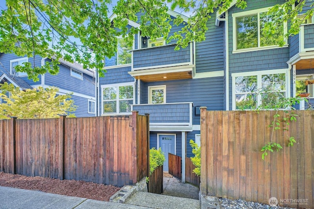view of front of house featuring fence