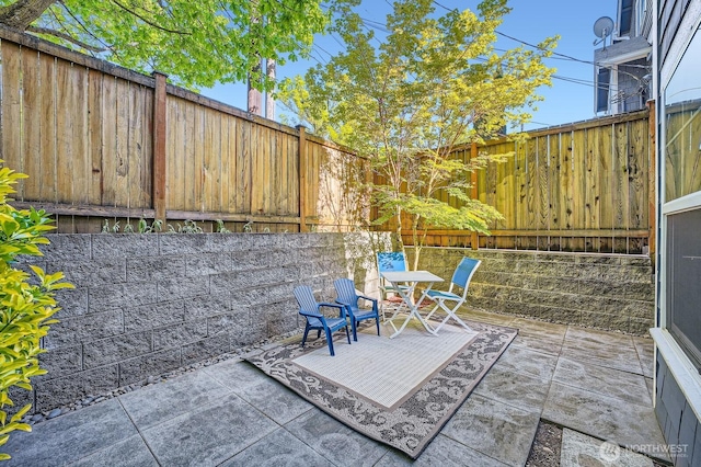 view of patio featuring a fenced backyard