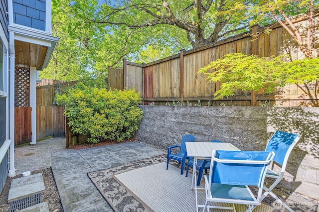 view of patio / terrace featuring a fenced backyard and outdoor dining area