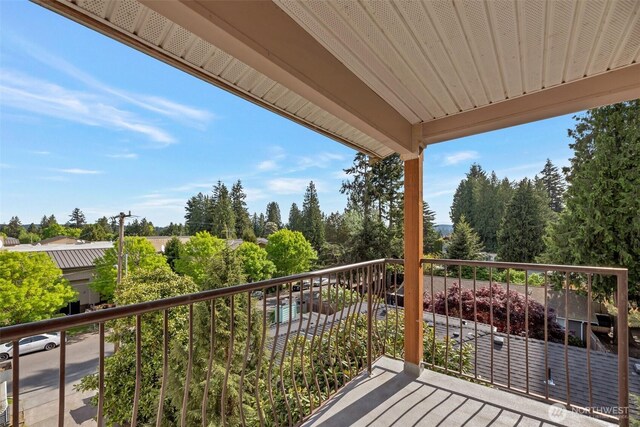 12050 15th Ave NE Unit 404, Seattle, WA 98125 - balcony featuring view of wooded area