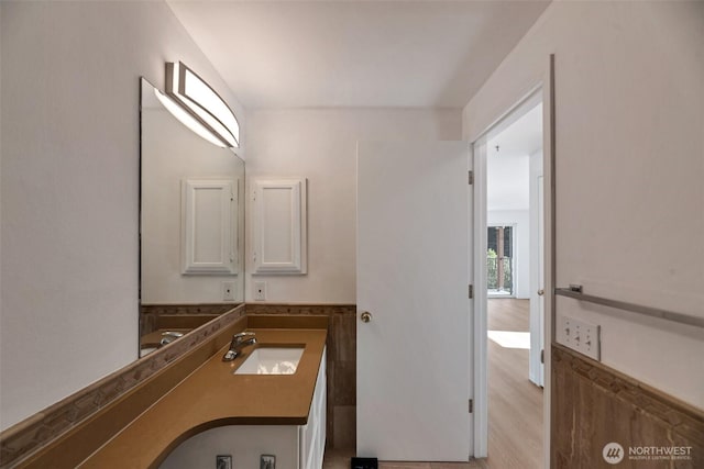 12050 15th Ave NE Unit 404, Seattle, WA 98125 - bathroom featuring wood finished floors and vanity