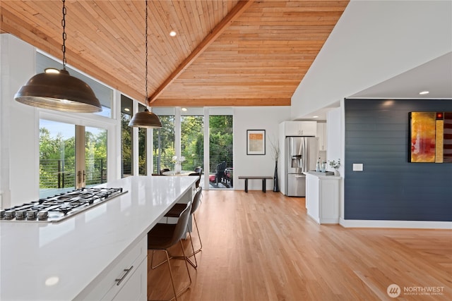 dining space with wooden ceiling, high vaulted ceiling, light wood-style flooring, recessed lighting, and baseboards
