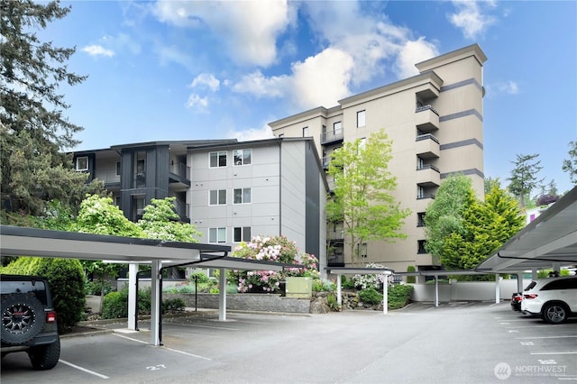 9201 NE Juanita Dr Unit 205, Kirkland, WA 98034 - view of apartment building / complex featuring covered parking