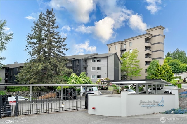 9201 NE Juanita Dr Unit 205, Kirkland, WA 98034 - view of apartment building / complex with covered parking