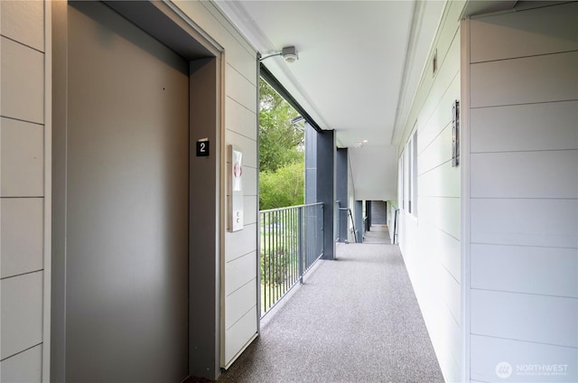 9201 NE Juanita Dr Unit 205, Kirkland, WA 98034 - corridor featuring elevator and carpet flooring