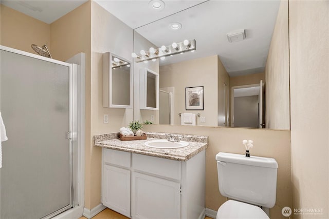 9201 NE Juanita Dr Unit 205, Kirkland, WA 98034 - full bath featuring a shower stall, vanity, toilet, and recessed lighting