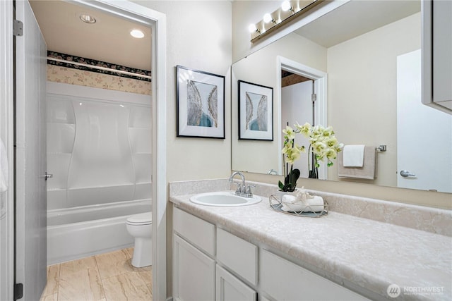 9201 NE Juanita Dr Unit 205, Kirkland, WA 98034 - bathroom with vanity, toilet, shower / tub combination, and marble look tile flooring