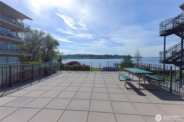 9201 NE Juanita Dr Unit 205, Kirkland, WA 98034 - view of patio with a water view