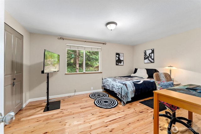 26911 312th Ave SE, Ravensdale, WA 98051 - bedroom featuring hardwood / wood-style flooring and baseboards