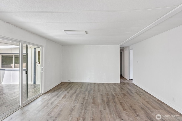 16300 State Highway 305 NE Unit 94, Poulsbo, WA 98370 - empty room with wood finished floors and baseboards
